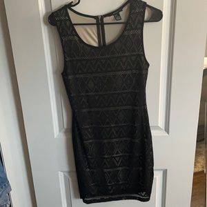 Black bodycon dress size M runs small